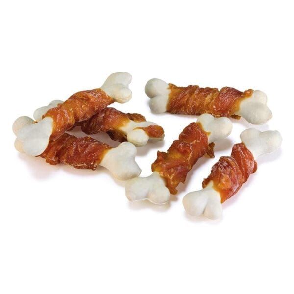 Trozos de hueso de perro con tocino y recompensa para mascotas.