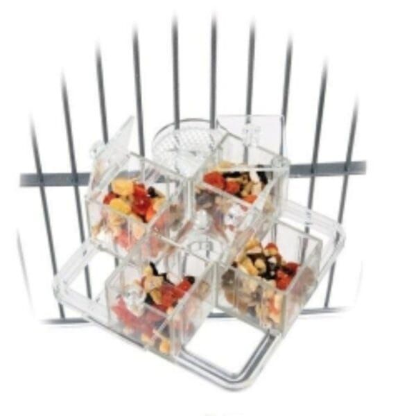 Mini dispensador de condimentos con compartimentos de plástico transparentes.