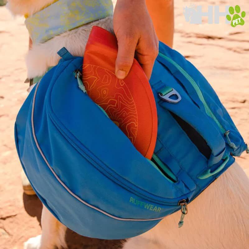 Bolsa de paseo para mascotas en azul con compartimentos y accesorios, ideal para transportar a tu mascota con estilo.