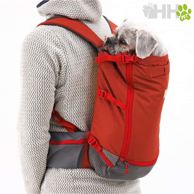 Bolso porta mascotas en mochila roja para perros y gatos.