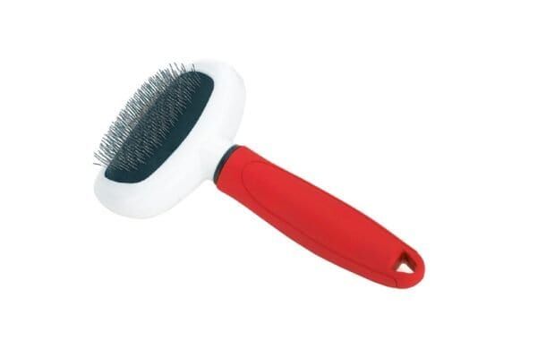 Cepillo metálico ovalado para perros y gatos pequeños, con mango ergonómico y suave para un cuidado delicado.